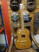 A mid-century acoustic guitar Condition reports provided on request by email for this auction