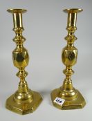 A pair of brass Queen of Diamond candlestick holders Condition reports provided on request by