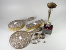 Two silver backed brushes with relief decoration and a similar hand mirror together with four silver