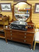 Edwardian inlaid mahogany dressing table having shield design mirror back raised on stile-type