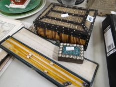 A porcupine quill box, a bejewelled pin box and a set of amber-type knitting needles in a case