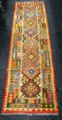 A vegetable dye wool Kelim runner, 78 x 257cms Condition reports provided on request by email for