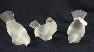 Three frosted glass doves in various poses, each inscribed 'Lalique, France' one with Made in France