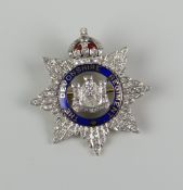 DIAMOND AND ENAMEL REGIMENTAL BROOCH OF DIAMOND SET SUNBURST DESIGN marked 'The Devonshire Regiment'