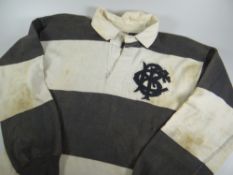A 1950s BARBARIANS RUGBY UNION JERSEY NUMBER 4 MATCH WORN BY GARETH GRIFFITHS in traditional black