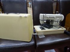 Cased Merritt electric sewing machine E/T