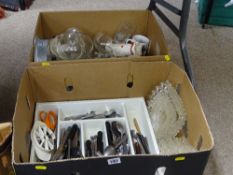 Two boxes of kitchenware, cutlery, glassware etc
