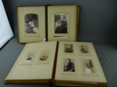 Two family photo albums with clasps (care with brown one please, delicate spine)