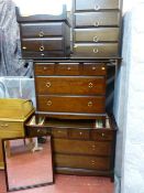 Suite of Stag Minstrel bedroom furniture including multi-drawer dressing table, bedside chests and