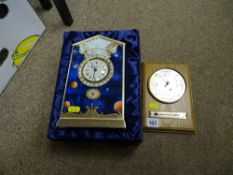 Cased Royal Worcester 2000AD limited edition porcelain mantel clock and a decorative barometer