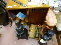 C Baker of London 7410 microscope, another small wooden cased microscope and a cased set of field