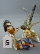 Two Goebel china bird figurines one of a kingfisher and a small Goebel angelic figurine playing a