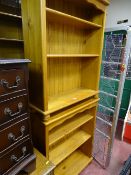 Two modern pine open front bookcases and a towel airer