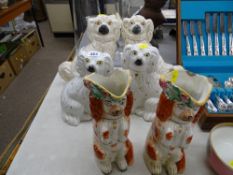 Pair of Staffs red and white 'begging' dog jugs with floral rims (damage to both) and two pairs of