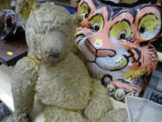 Vintage fibreglass advertising model of a tiger and an old teddy bear