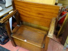 Compact mahogany settle with folding back and box seat