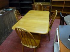 Probably light Ercol gate leg table and set of four spindleback chairs