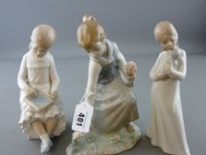 Lladro figurine of young girl with bunch of flowers and two Nao figurines - seated child with