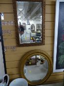 Gilt framed oblong bevelled mirror and a gilt framed circular bevelled mirror