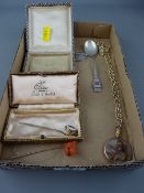 Silver framed dried flower pendant on a yellow metal chain, two stickpins, a sterling silver