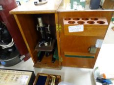 Cased 'Prior of London' black enamelled microscope (no extra lenses)