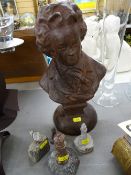 Circular based metallic bust of Mozart and four small lighthouse mineral items