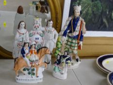 Four 19th Century Staffs pottery groups including 'Returning Home' and a 'Scottish Hunter' (