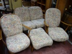 Ercol medium suite comprising two armchairs, footstool and two seater settee