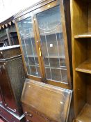 1930's bookcase bureau having two leaded and glazed doors to the top with shaped panes, centre