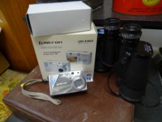 Boxed digital camera and a pair of modern binoculars