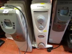 Three oil filled radiators on wheels with timers E/T