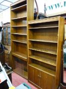 Two good oak effect open bookcases, one with two base cupboards and a glass fronted bookcase