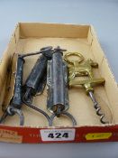 Three spring balances and a terrier dog handled brass corkscrew