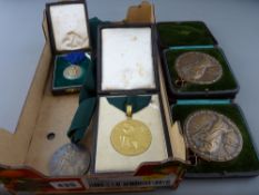 Two cased John Pinches National Eisteddfod medallions, each marked 'Taliesin', a gilt silver drama