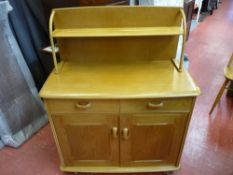 Probably Ercol two door and two drawer sideboard with upper shelf rack
