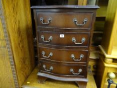 Reproduction serpentine front four drawer chest