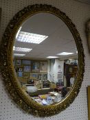 Good oval gilt framed bevelled wall mirror, 67 x 50 cms