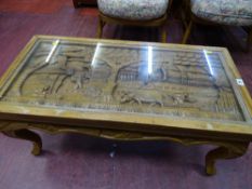 Oriental deep carved glass topped coffee table