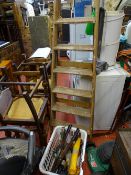 Wooden stepladder, garden rake, long handled shears and white basket containing various items