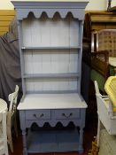 Painted compact dresser of two shelves with two base drawer over a lower shelf