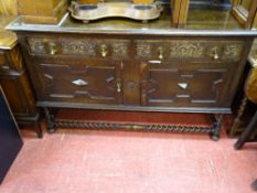 Polished wood railback sideboard with twin carved front drawers over 'X' fronted drawers with