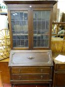 Polished wood bureau bookcase with twin lead glazed doors
