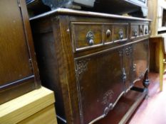 Polished wood sideboard with two drawers over carved base drawers etc