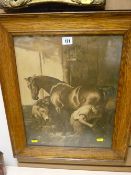 Antique oak framed print of a blacksmith with horse at work