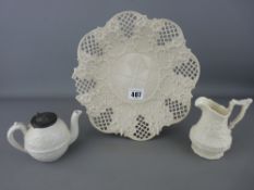 Cream ware reticulated plate (damage), a small Victorian relief patterned teapot and a similarly