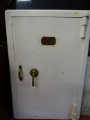 White painted floorstanding safe with plaque 'Withey Grove Stores Safe Factors, Office Furnishers,