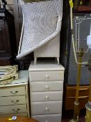 Cream slim five drawer chest and a parcel of white loom items