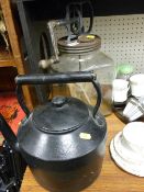 Glass lidded butter churn and an iron kettle
