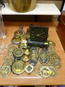 Quantity of horse brasses, slate mantel clock and Swarovski type ornaments