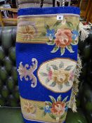 Cobalt blue floral bordered washed rug